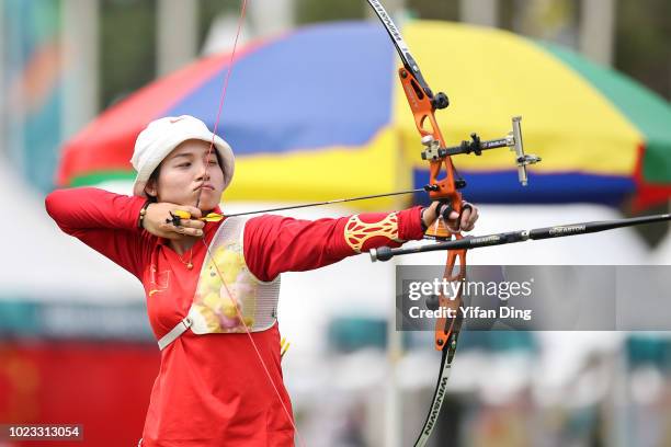 Zhang Xinyan of China in action during Archery Recurve Women's Team Quarterfinal between China and Kazakhstan on day seven of the Asian Games on...