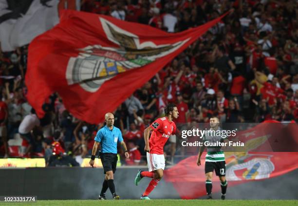 Joao Felix of SL Benfica celebrates after scoring a goal during the Liga NOS match between SL Benfica and Sporting CP at Estadio da Luz on August 25,...