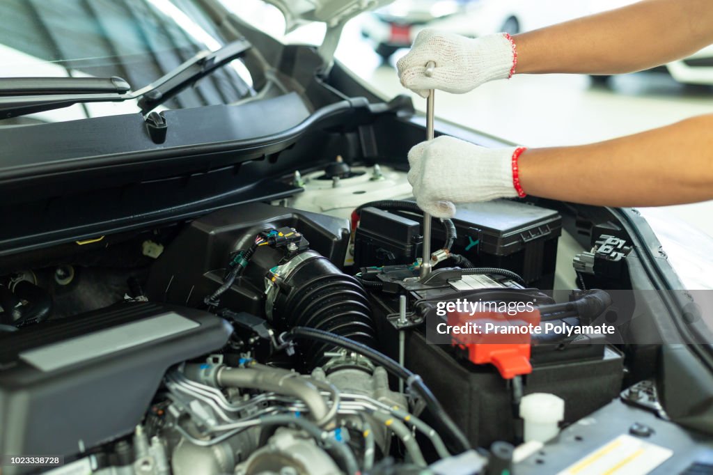 Auto mechanic working in garage, Car Repair Service center.