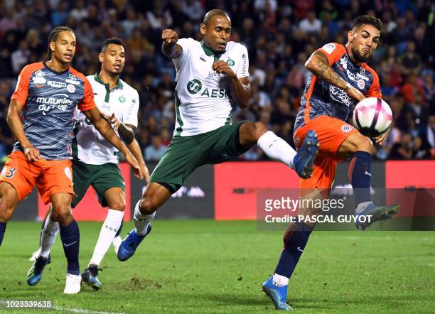 Saint-Etienne's Brazilian defender Gabriel Silva vies with Montpellier's French forward Andy Delfort during the French L1 football match between...