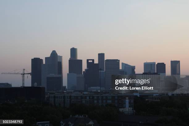 The downtown skyline is pictured as the sun rises on August 25, 2018 in Houston, Texas. August 25 is the one-year anniversary of when Hurricane...