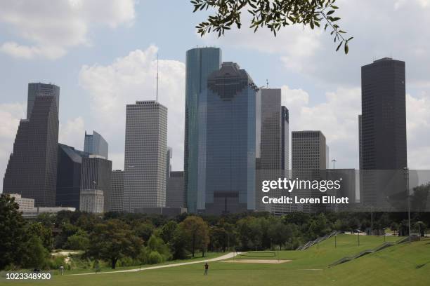 Downtown high-rises are pictured beyond Buffalo Bayou on August 25, 2018 in Houston, Texas. August 25 is the one-year anniversary of when Hurricane...