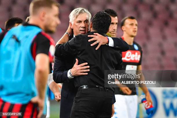 Napoli's Italian coach Carlo Ancelotti embraces AC Milan's Italian coach Gennaro Gattuso after the Italian Serie A football match Napoli vs AC Milan...