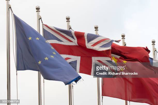 flags of china, european union and united kingdom - british and eu flag foto e immagini stock
