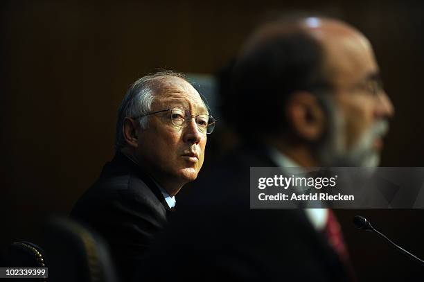 Interior Secretary Ken Salazar watches as Michael Bromwich, director of the Bureau of Ocean Energy Management, Regulation and Enforcement testifies...