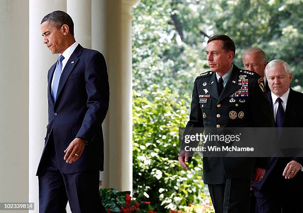 President Barack Obama walks with Gen. David Petraeus, who will succeed Gen. Stanley McChrystal as commander of U.S. Forces in Afghanistan; Vice...