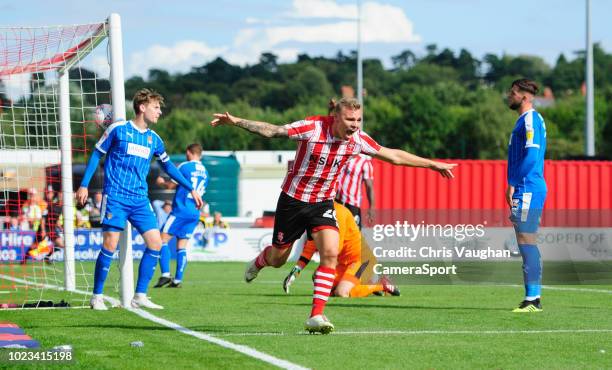 Lincoln City's Harry Anderson celebrates scoring his side's third goal during the Sky Bet League Two match between Lincoln City and Notts County at...