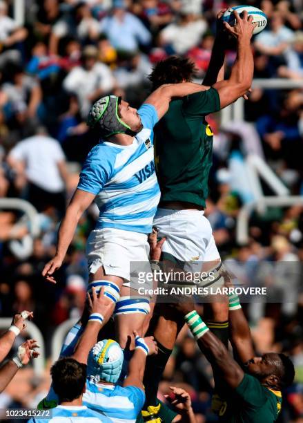 Argentina's Los Pumas Guido Petti vies for the ball with South Africa's Springboks Eben Etzebeth during a Rugby Championship 2018 test match at...