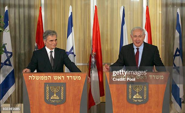 Israeli Prime Minister Benjamin Netanyahu smiles as Austrian Chancellor Werner Faymann listens to him during a joint statement to the press at...