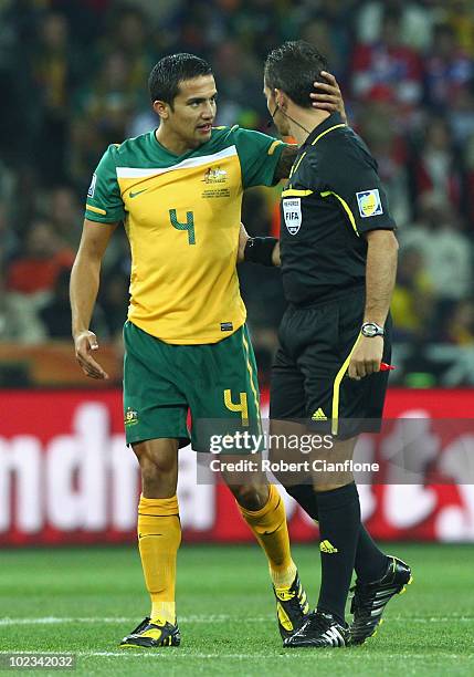 Tim Cahill of Australia speaks to referee Jorge Larrionda during the 2010 FIFA World Cup South Africa Group D match between Australia and Serbia at...