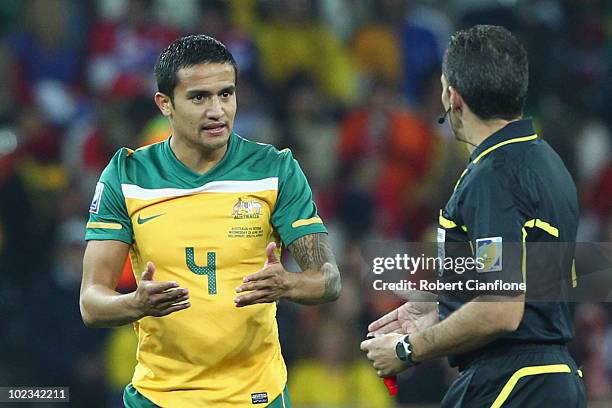 Tim Cahill of Australia speaks to referee Jorge Larrionda during the 2010 FIFA World Cup South Africa Group D match between Australia and Serbia at...