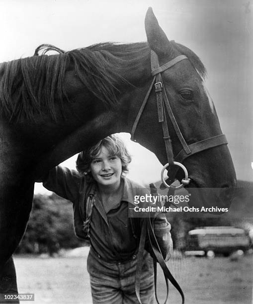 Joe Evans with his black stallion in a scene from the movie "Black Beauty" which was released in 1971.