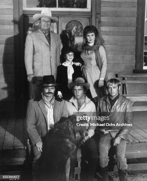 John Wayne, John Ethan Wayne , Maureen O'Hara, and Patrick Wayne, Bobby Vinton, and Chris Mitchum pose for a family portrait in a scene from the...