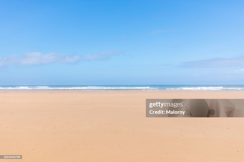 Panoramic view of the empty beach and waves. Sea in the background. Sidi Kaouki, Morocco.