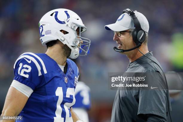 Head coach Frank Reich of the Indianapolis Colts talks with Andrew Luck in the first quarter of a preseason game against the San Francisco 49ers at...