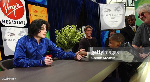 Michael Jackson and a fan at record signing