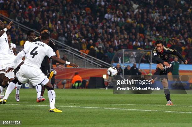 Mesut Oezil of Germany scores the opening goal during the 2010 FIFA World Cup South Africa Group D match between Ghana and Germany at Soccer City...