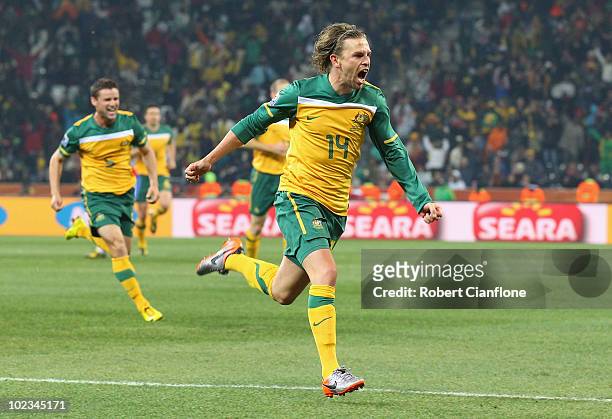 Brett Holman of Australia celebrates scoring his side's second goal during the 2010 FIFA World Cup South Africa Group D match between Australia and...