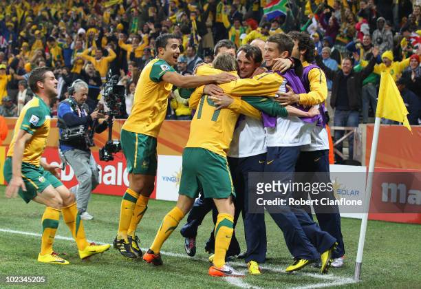 Brett Holman of Australia celebrates with team mates after scoring his side's second goal during the 2010 FIFA World Cup South Africa Group D match...