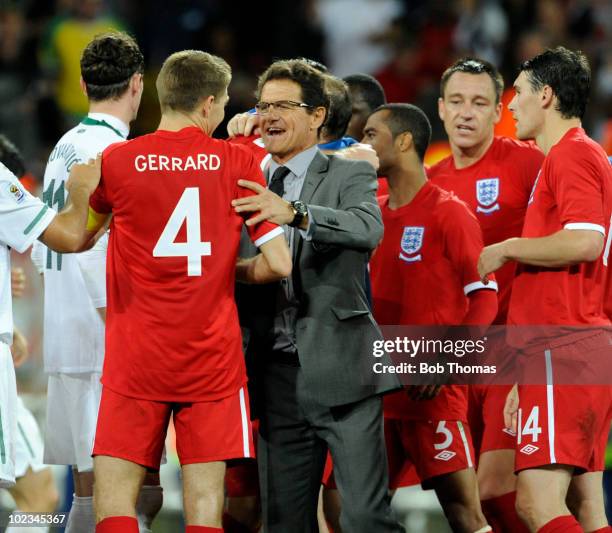 England coach Fabio Capello congratulates England captain Steven Gerrard after the 2010 FIFA World Cup South Africa Group C match between Slovenia...