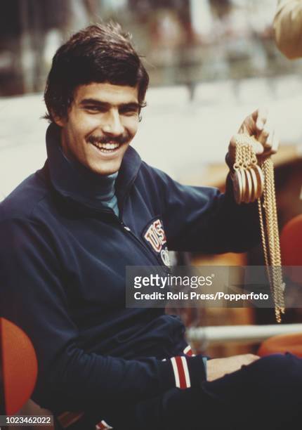 American swimmer Mark Spitz of the United States team holds five of his gold medals won in swimming events at the 1972 Summer Olympics in Munich,...