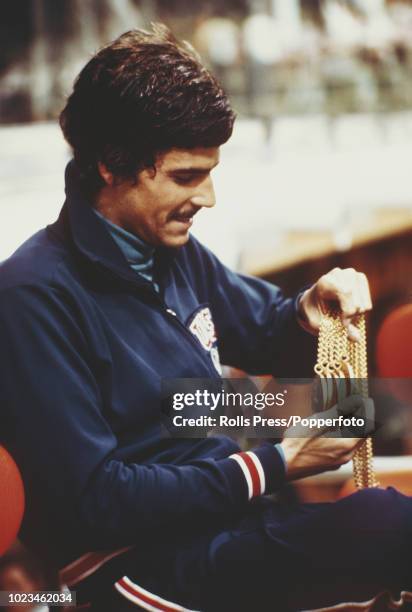 American swimmer Mark Spitz of the United States team holds five of his gold medals won in swimming events at the 1972 Summer Olympics in Munich,...