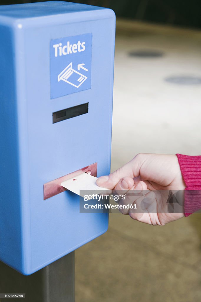 Germany, Bavaria, Munich, Person at ticket barrier in subway station