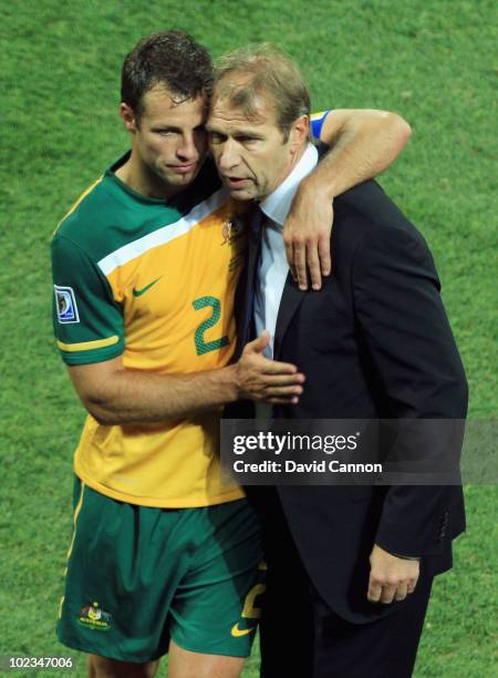 Pim Verbeek head coach of Australia hugs Lucas Neill after victory in the game but elimination from the tournament in the 2010 FIFA World Cup South...