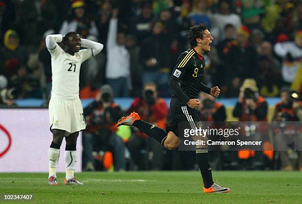 Mesut Oezil of Germany celebrates scoring the opening goal during the 2010 FIFA World Cup South Africa Group D match between Ghana and Germany at...