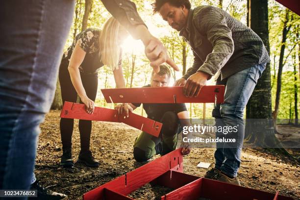 i think that goes there - team building activity stock pictures, royalty-free photos & images