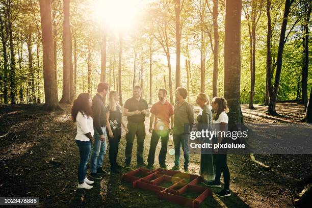 coming together as a team - mixed age range stock pictures, royalty-free photos & images