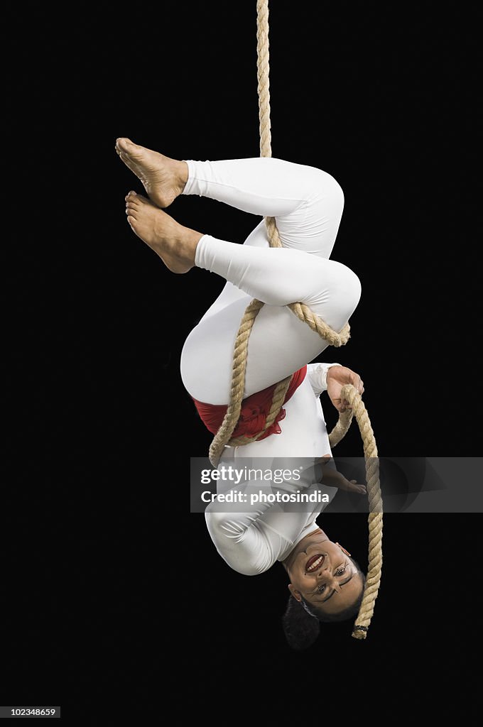 Acrobat performing on a rope