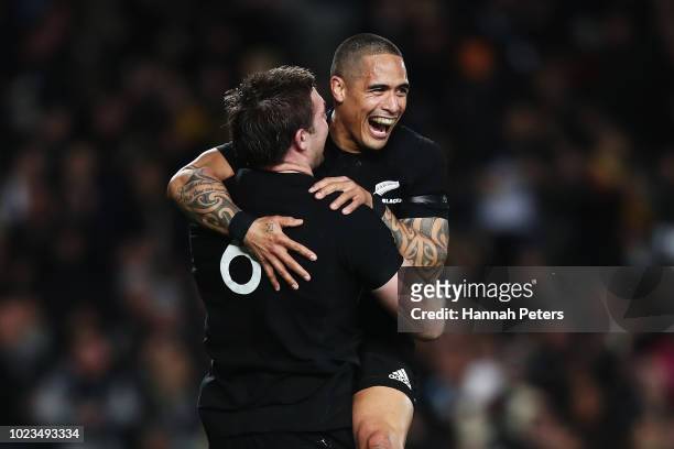 Liam Squire of the All Blacks celebrates after scoring a try with Aaron Smith during The Rugby Championship game between the New Zealand All Blacks...