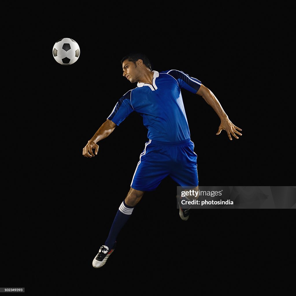 Man heading a soccer ball