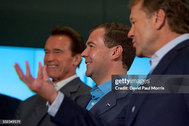 Russian President Dmitry Medvedev listens to Cisco Chairman and CEO John Chambers as California Gov. Arnold Schwarzenegger looks on during a...