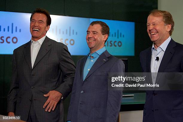 Russian President Dmitry Medvedev laughs with Cisco Chairman and CEO John Chambers and California Gov. Arnold Schwarzenegger during a demonstration...