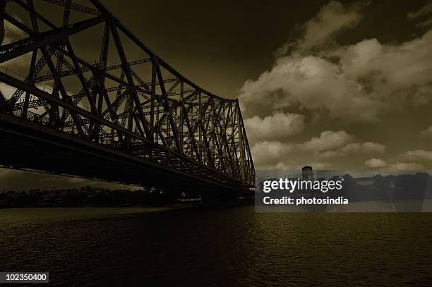 bridge across the river, howrah bridge, hooghly river, kolkata, west bengal, india - howrah bridge stock pictures, royalty-free photos & images