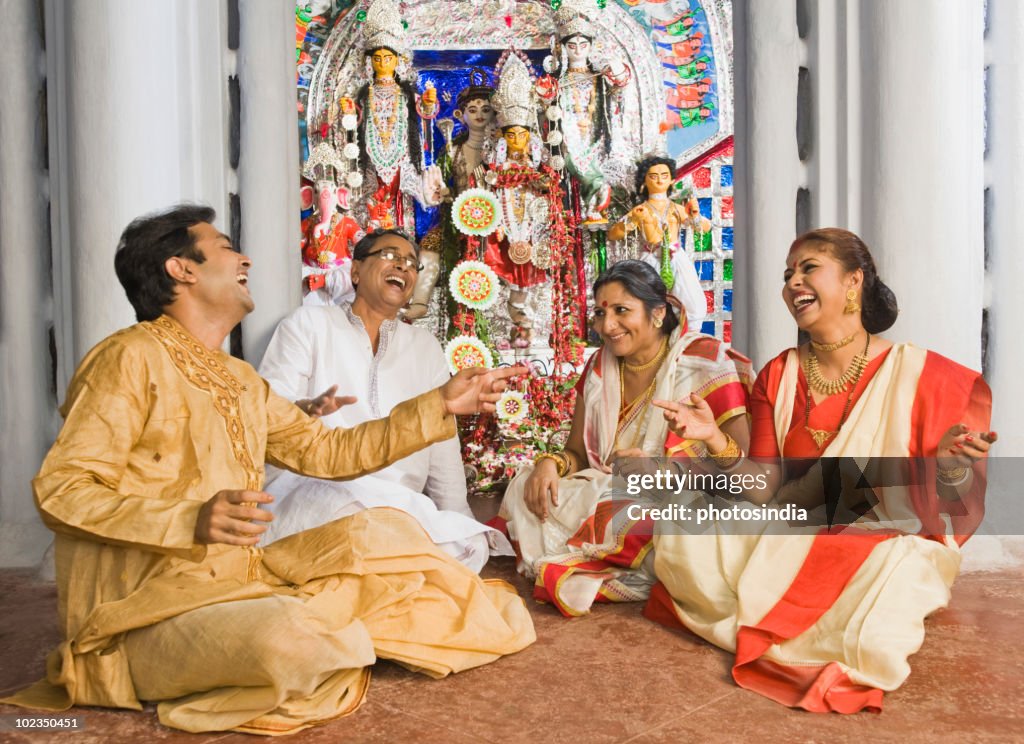 Family sitting in a temple