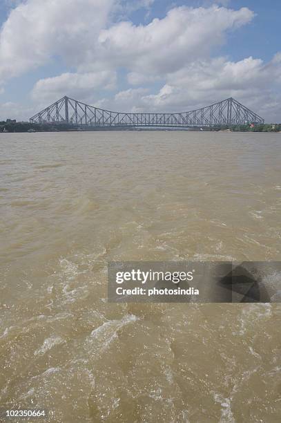 bridge across the river, howrah bridge, hooghly river, kolkata, west bengal, india - howrah bridge stock pictures, royalty-free photos & images