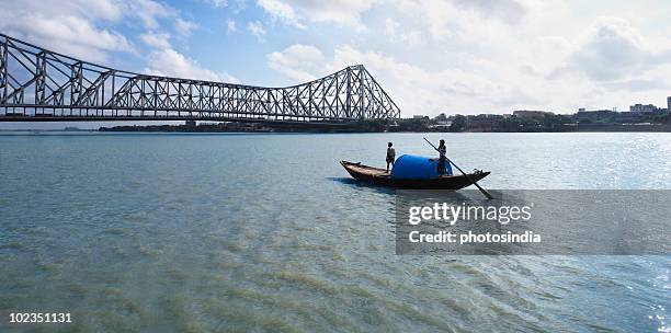 bridge across the river, howrah bridge, hooghly river, kolkata, west bengal, india - howrah bridge stock pictures, royalty-free photos & images