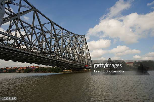 bridge across the river, howrah bridge, hooghly river, kolkata, west bengal, india - howrah bridge stock pictures, royalty-free photos & images