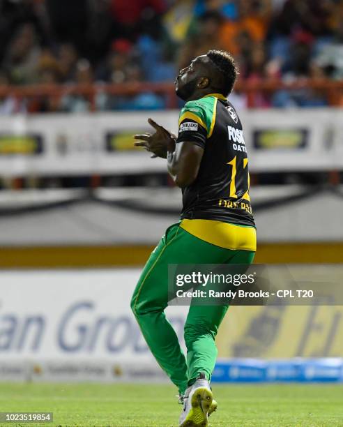 In this handout image provided by CPL T20, Andre Russell of Jamaica Tallawahs takes the catch to dismiss Andre Fletcher of St Lucia Stars during...