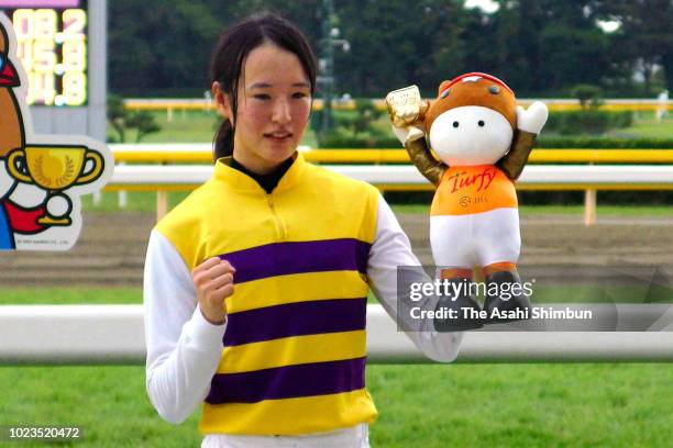 Jockey Nanako Fujita celebrates her 35th win in her JRA career at Niigata Racecourse on August 25, 2018 in Niigata, Japan.