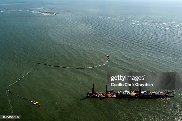 Dredging boats sit idle along the Chandeleur islands on June 23, 2010 in the Gulf of Mexico along the coast of Louisiana. Federal authorities halted...
