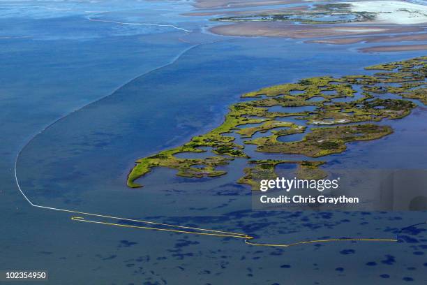 Oil booms surround portions of the Chandeleur islands on June 23, 2010 in the Gulf of Mexico along the coast of Louisiana. Federal authorities halted...