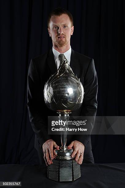 Henrik Sedin of the Vancouver Canucks poses for a portrait with the Hart Memorial Trophy during the 2010 NHL Awards at the Palms Casino Resort on...
