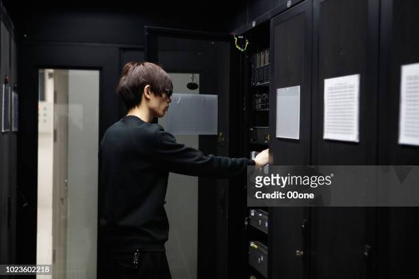 it expert working on computer server equipment - china firewall stock pictures, royalty-free photos & images
