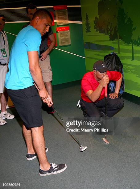 Emerson Etem and a statue of Tiger Woods during the Top NHL Draft Prospects At The Hollywood Walk of Fame on June 23, 2010 in Hollywood, California.