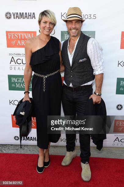 Arianne Zucker and Shawn Christian arrive at the Festival of Arts Celebrity Benefit Event on August 25, 2018 in Laguna Beach, California.