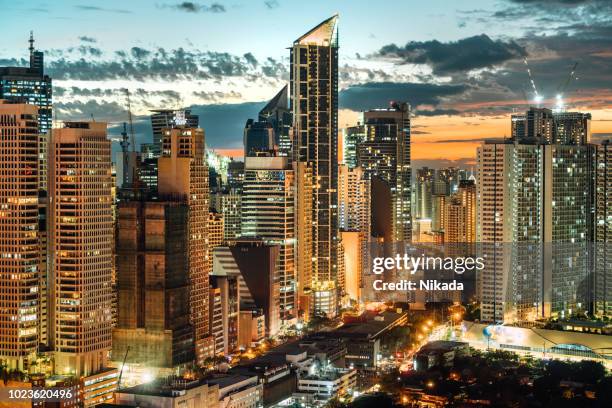 manila makati at twilight - makati stock pictures, royalty-free photos & images